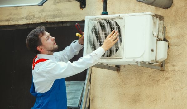plumber-repair-experienced-attentive-middleaged-man-examining-bottom-kitchen-sink